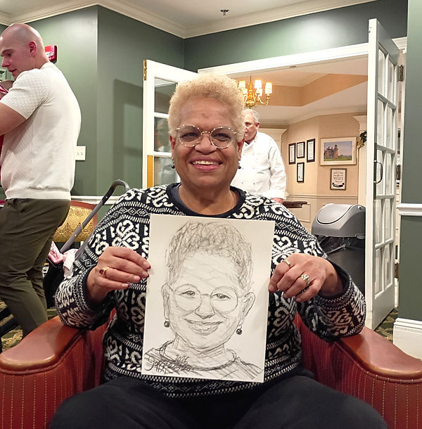 Live caricature artist entertaining guests at a Christmas event.