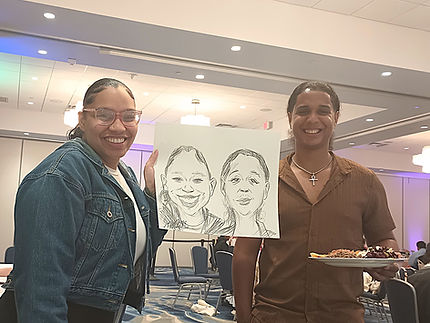 Two women holding a finished caricature drawing of three people