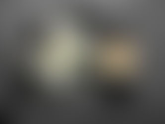 Memorial flowers; lily, candle and ribbon