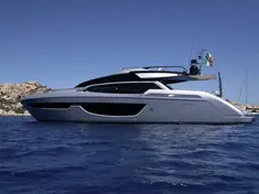 Riva Perseo 76 luxury yacht anchored in a crystal-clear bay in Northern Sardinia.