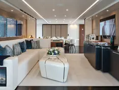Wide interior of the Heesen 50m main salon featuring floor-to-ceiling panoramic windows.