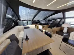 Main deck lounge of Riva Perseo 76 yacht featuring comfortable sofas and sophisticated design.