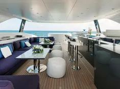 Expansive sun deck lounge with comfortable designer sofas on the Heesen 50m.