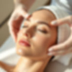 Close-up commercial skincare photography of a woman receiving a luxurious facial treatment