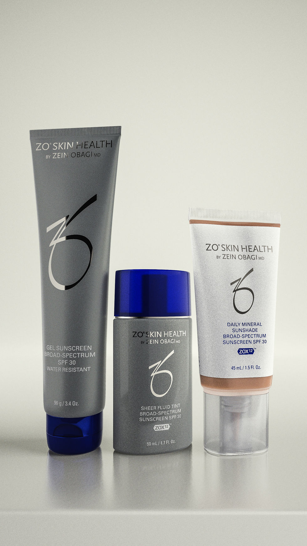 Tre ZO Skin Health-solskyddsprodukter på ljus bakgrund: grå tub, flaska med blått lock och vit tub.