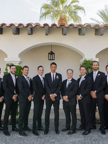The Groom poses with thirteen groomsmen at the Emerson Estate.