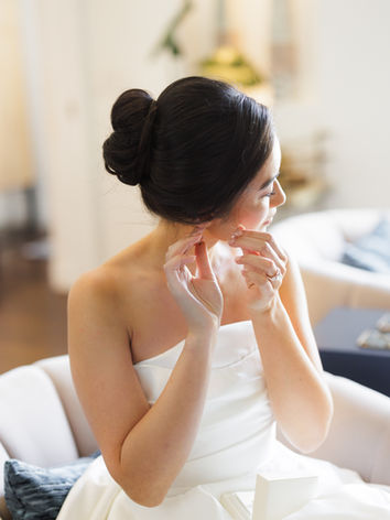 Bride fixing her earring at the Emerson Estate