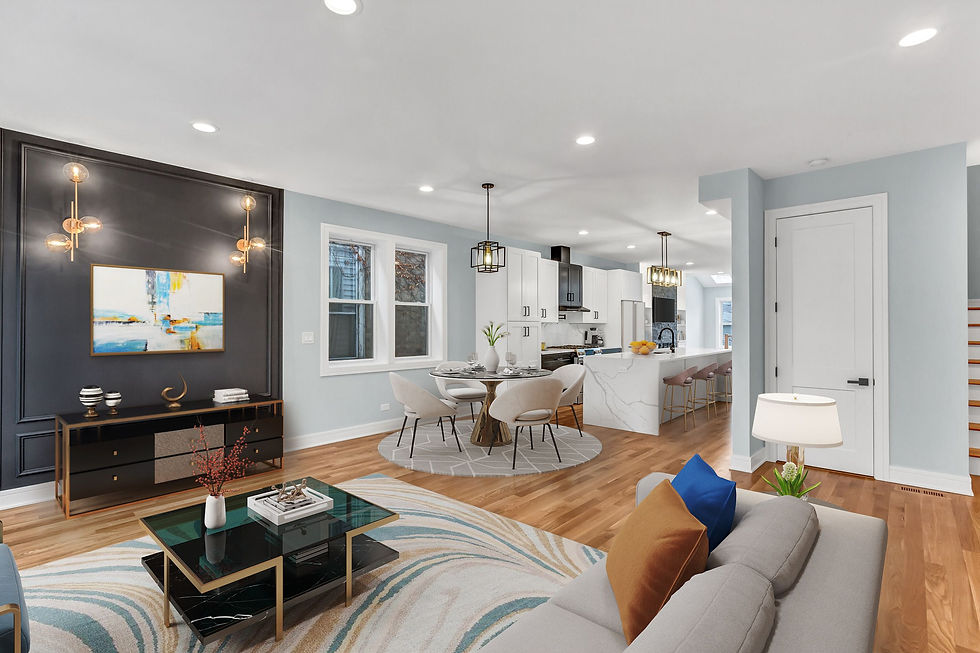 Main level family room with open concept kitchen and black accent wall.