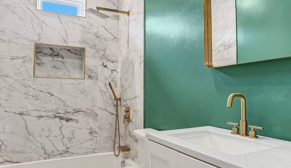 Secondary bathroom with a walk-in shower, luxury tilework, and gold hardware.