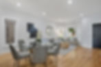Spacious family and dining room with oak flooring.