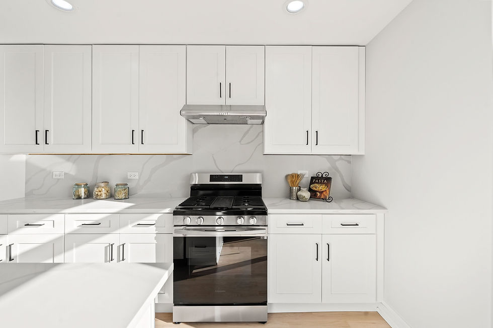 Modern kitchen with granite countertops, stainless steel appliances, white shaker cabinets, and upgr