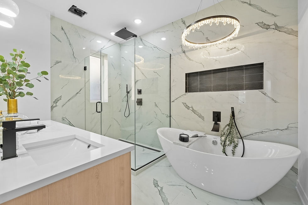 Full bathroom renovation with floor-to-wall tilework, spacious double vanity, a glass walk-in shower