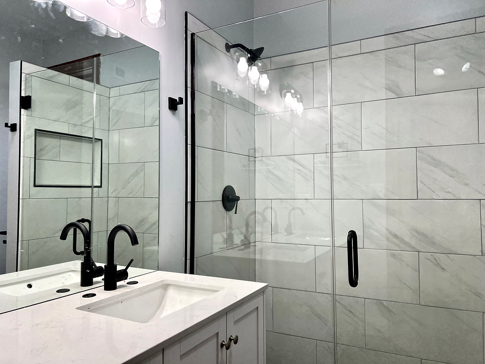 Complete gut bathroom renovation with a new layout featuring a walk-in shower, matte black hardware,