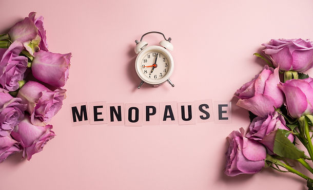 Word Menopause with pink roses and alarm clock, flat lay, pink background.jpg