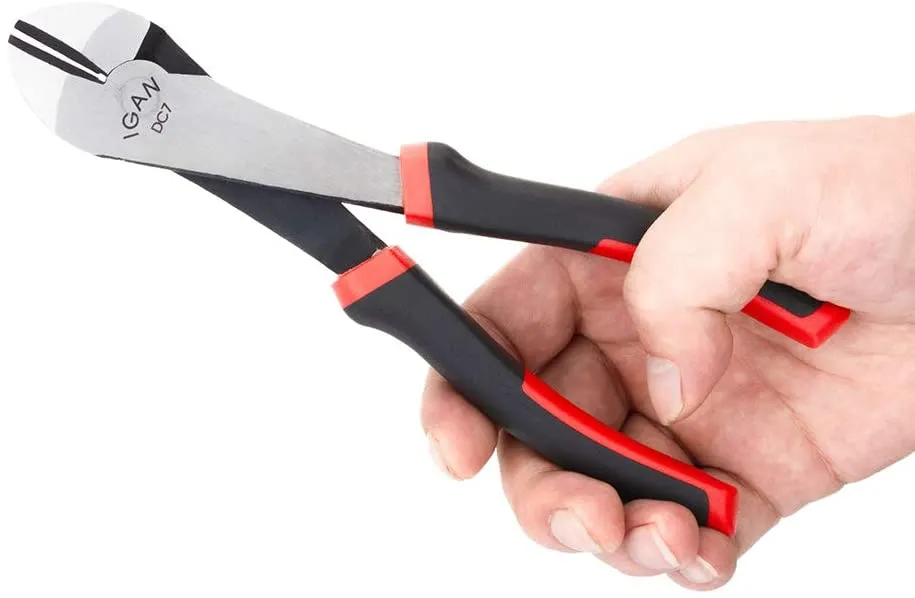 Hand holding black and red wire cutters with "IGAN DC7" printed on them against a white background.