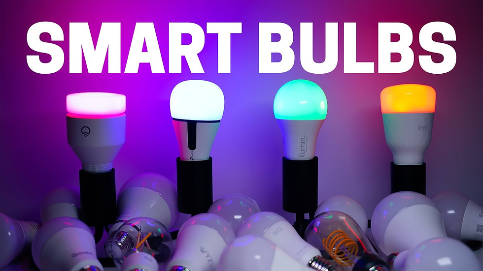 Smart bulbs glow in pink, blue, and orange on a table, surrounded by unlit bulbs. "SMART BULBS" text above on a purple background.
