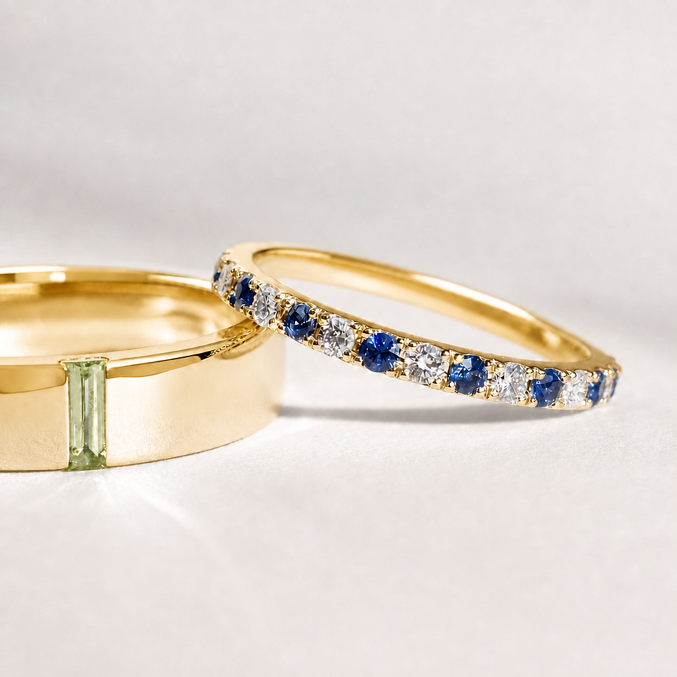 Thumbnail: Yellow gold custom birthstone wedding band set with baguette and blue stone details