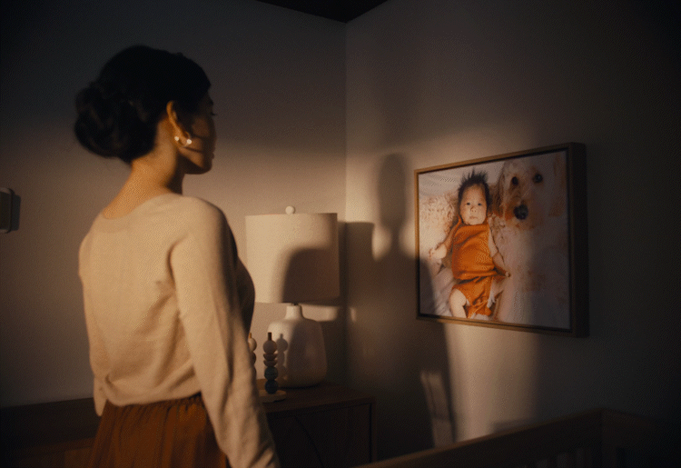 moving light illuminating a picture of a baby.