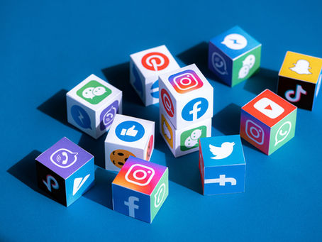 A paper cubes collection with printed logos of world-famous social networks and online messengers, such as Facebook, Instagram, YouTube, Telegram and others.