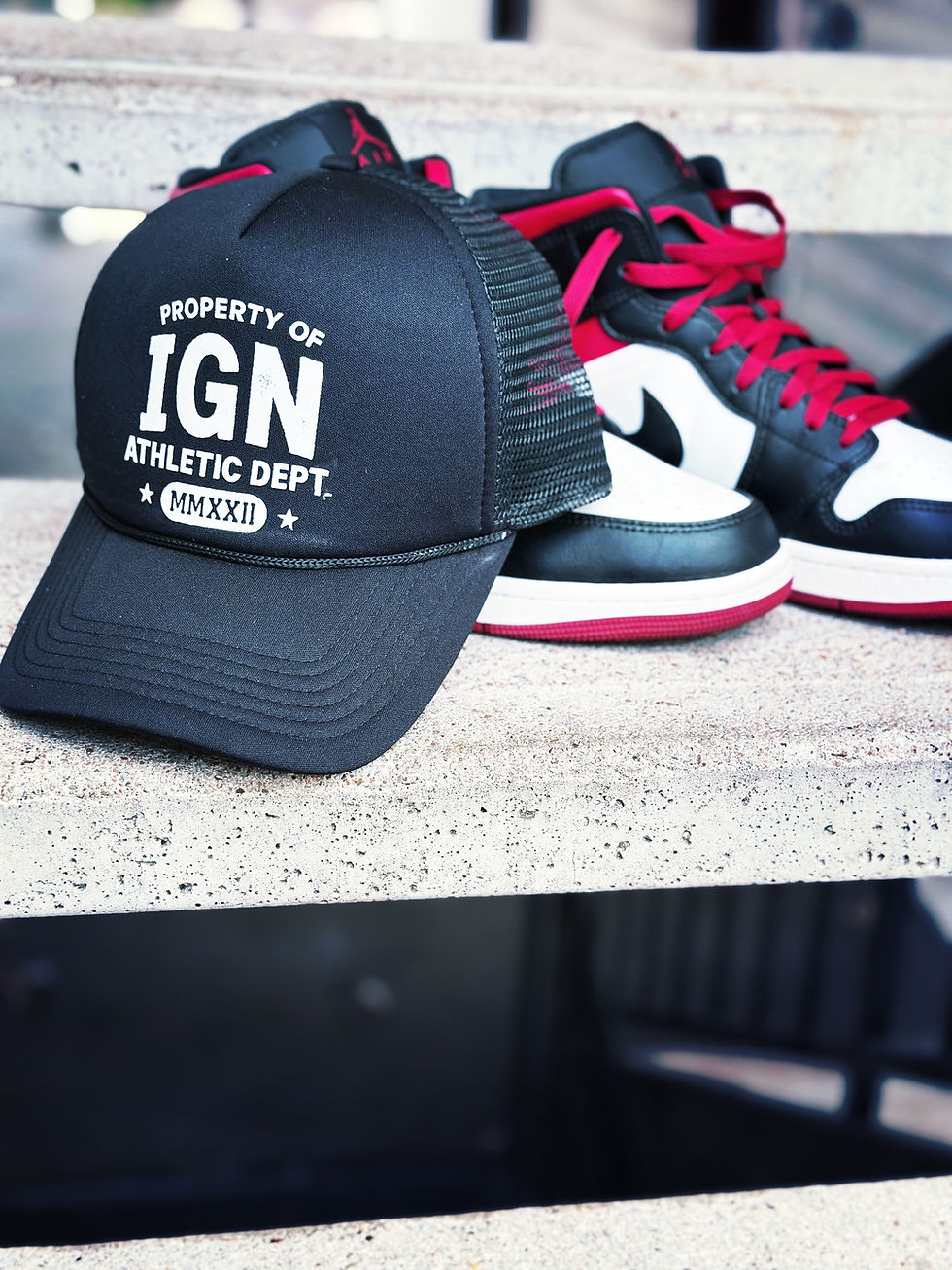 Black (POIGN) trucker hat