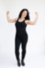 Dr. Annette Cronauer, Founder, in black tank top and black leggings.