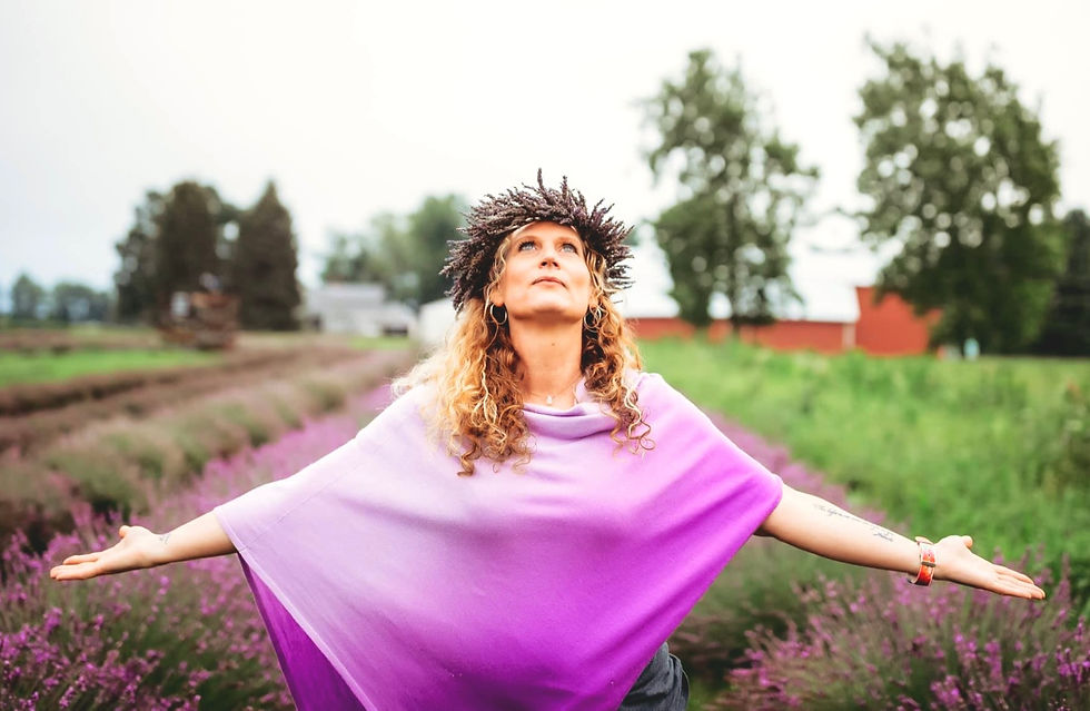 Shelly Varelli arms wide open in lavender field