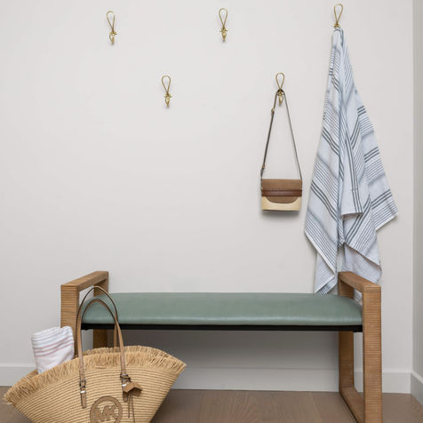 Bedroom bench with nautical wall hooks, beach bag and beach towel