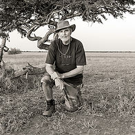 A black and white portrait of fine art landscape photographer Peter Corbett.