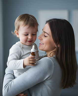Mom holding her youg toddler, holding a bottle of medicine, both of tem smiling__clear and
