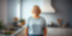 American woman standing in kitchen searching for pharmacy near me