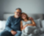 American male middle age Patient sitting on bed in warm moment, calling pharmacy near me
