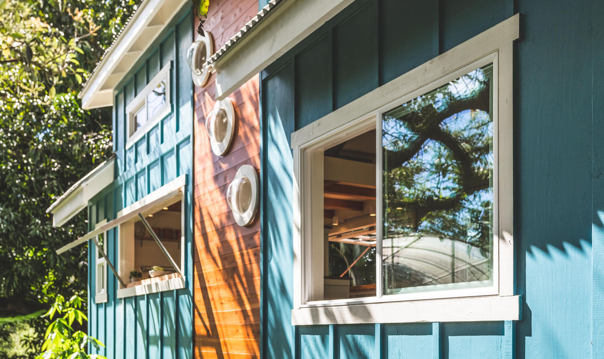 Paradise Tiny Homes
Ellie K Design
Big Island
Oahu, Maui, Kauai, Hawaii luxury homes, real estate, hawaii living, moving to hawaii, hawaii style interior design, condos, portable, modular, Accessory Trailer Unit
The smiles that come over guests faces when they lay eyes on the happy exterior of the Oasis is contagious. This exterior is painted "Cabana Blue" keeping those dreamy ocean vibes with you wherever it's placed. A cedar wood accent warms things up putting three playful bubble windows on high display. 