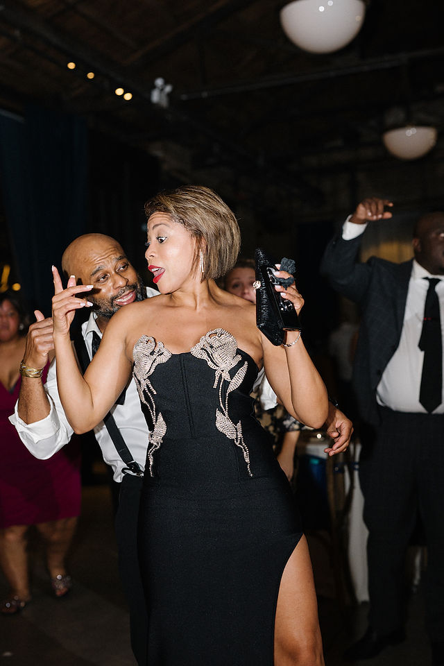 Guests dance and celebrate at loft wedding.