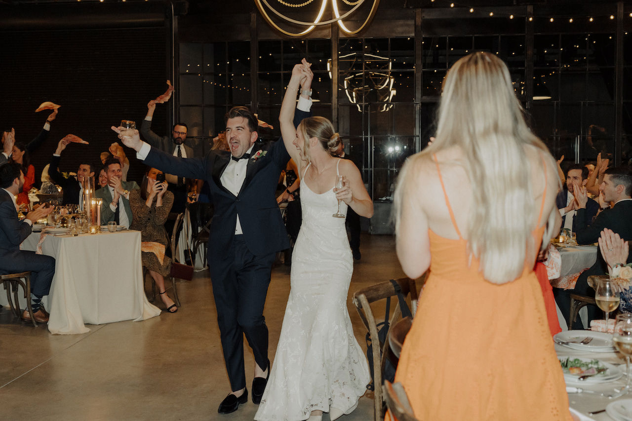 Newlyweds enter dinner reception.