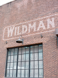 Photo capturing the exposed brick and light of industrial loft. 