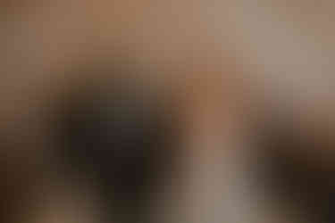 Bride looks romantically at groom