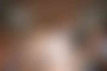 Bride and groom laughing during toasts at their candlelit Wildman BT wedding reception.