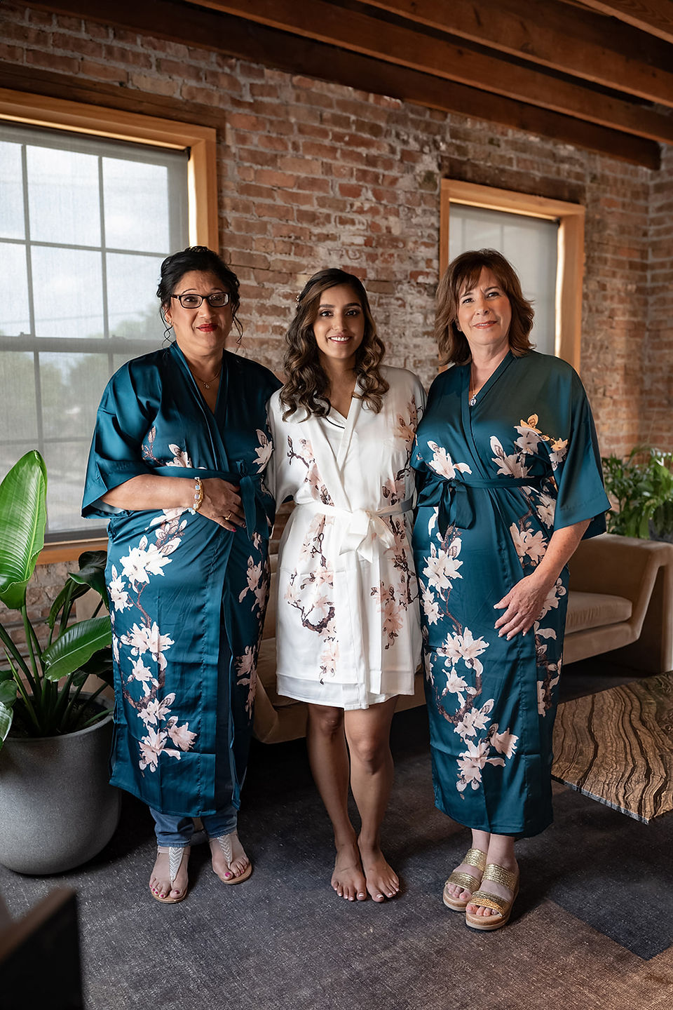 Bride, mother, and mother-in-law getting ready.