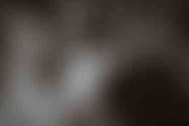 Bride adjusts groom's collar during cocktail hour at Wildman BT wedding in Chicago.