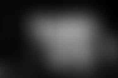 Couple ascend metal industrial staircase.