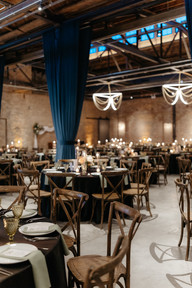 Large industrial venue with stunning wedding setup.