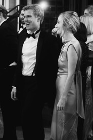 Guests enjoy cocktail hour in black-tie attire. 