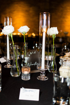 Close up of candles and table settings at chic Chicago wedding.