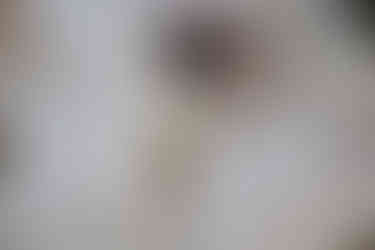 Wedding day details with white beaded purse.