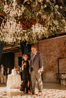 Golden lighting over newlyweds parents