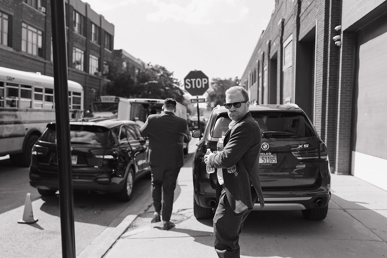 Grooms strut outside on Chicago street.