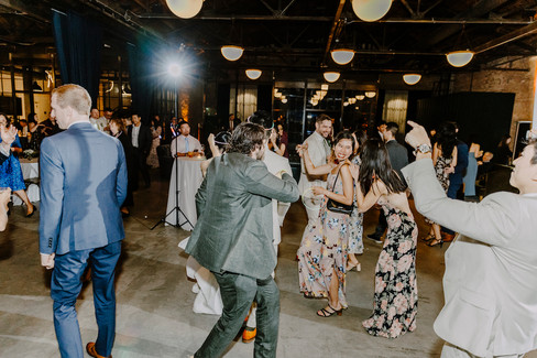Guests dance and enjoy Chicago loft reception.