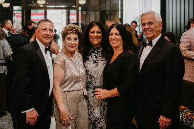 Guests smile and enjoy high-end cocktail hour in Chicago.