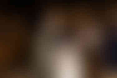 Bride and groom enjoy dancing with guests.