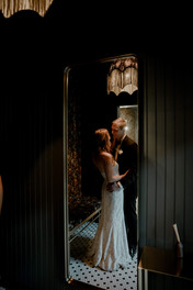 Romantic photo of newlyweds in green ambiance